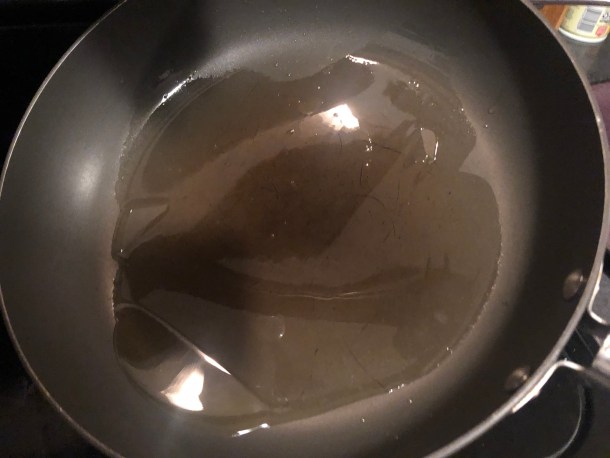 Cooking Eorzea | Adding olive oil to a pan.