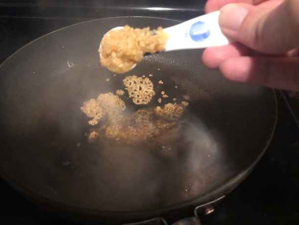 Cooking Eorzea | Adding minced garlic.